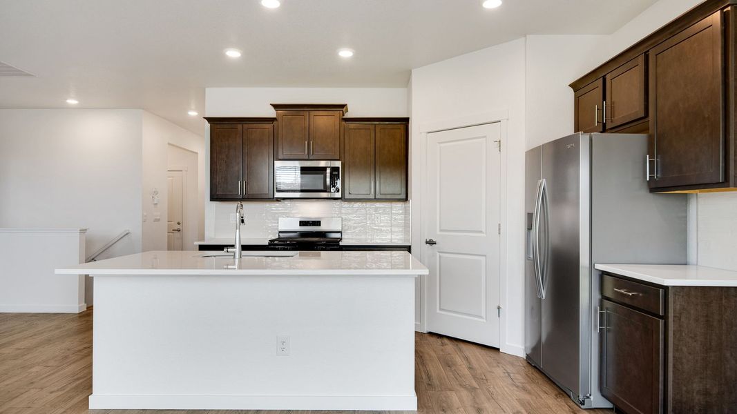Representative furnished interior of a home built from the Harmony by D.R. Horton in Sky Ranch, Watkins (Image 6).