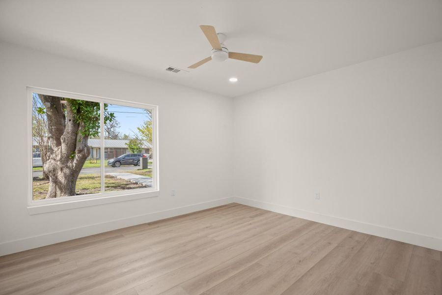 Spare room with light wood-type flooring, recessed lighting, and ceiling fan