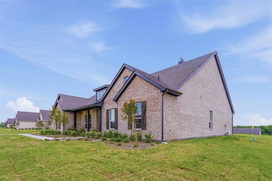 This property features a brick exterior with dark trim and a gabled roofline