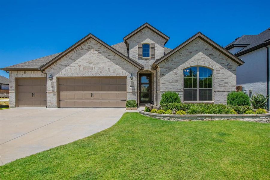 Front exterior of a new home in , Midlothian, TX, highlighting curb appeal (Image 2). Front exterior of a new home in , Midlothian, TX, highlighting curb appeal (Image 2).