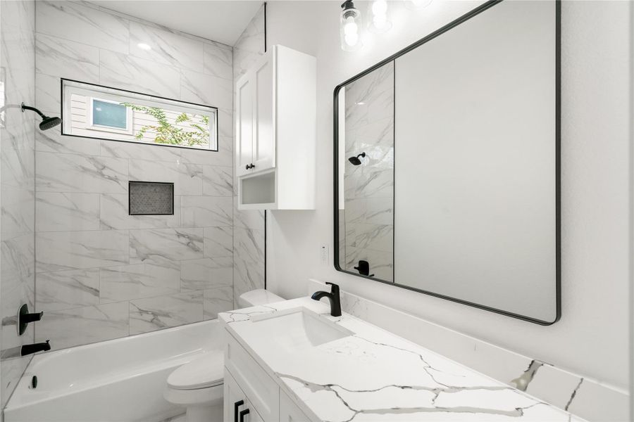 Stunningly second bathroom with modern fixtures and elegant finishes.