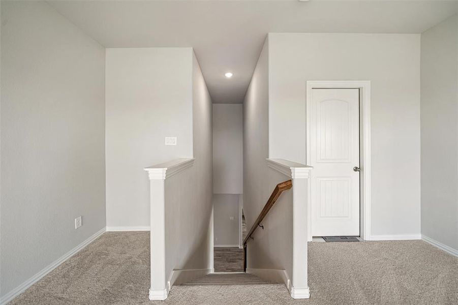 Stairway featuring carpet and recessed lighting Stairway featuring carpet and recessed lighting