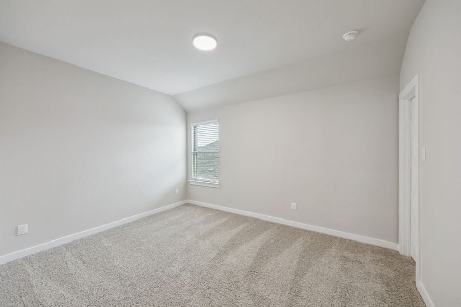 Bedroom in the Stanley II home plan by Trophy Signature Homes – REPRESENTATIVE PHOTO