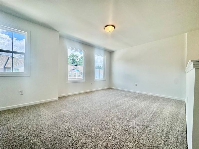 Spacious, unfurnished interior of a new home in Eastlyn Crossing, Flowery Branch (Image 28).