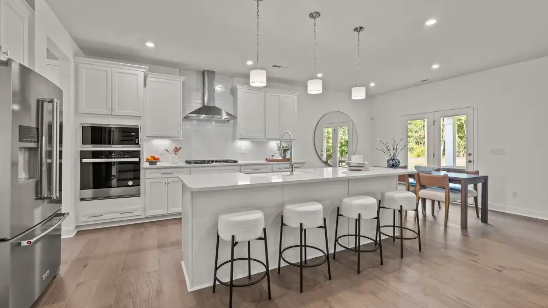 The Townsend Design gourmet kitchen with wall oven and built-in microwave at Lakeside Glen by DRB Homes in York, SC. The Townsend Design gourmet kitchen with wall oven and built-in microwave at Lakeside Glen by DRB Homes in York, SC.