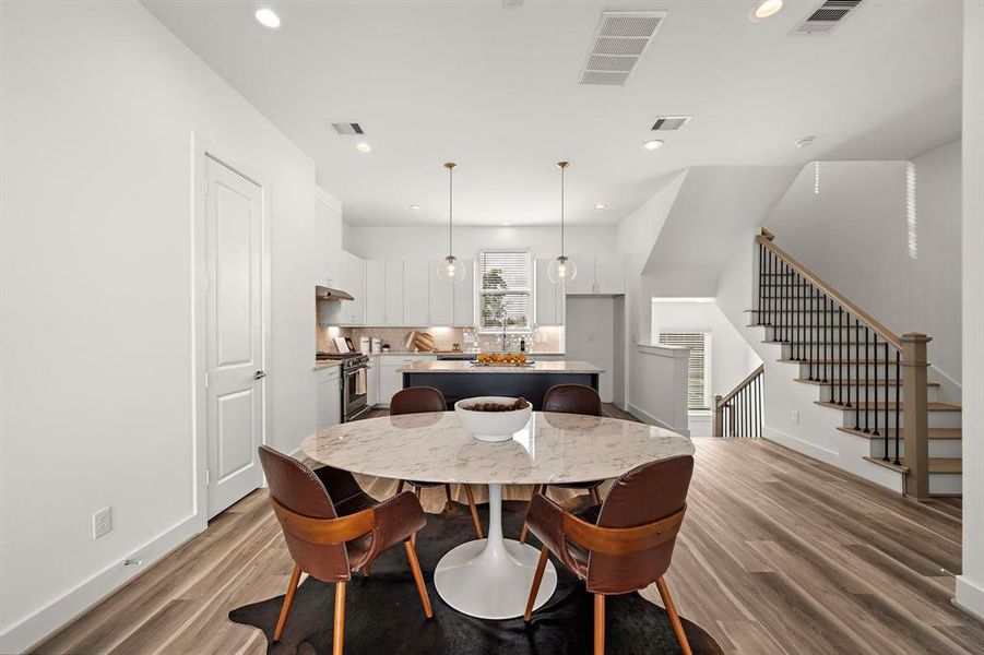 The dining table fits beautifully between the kitchen and the living area.