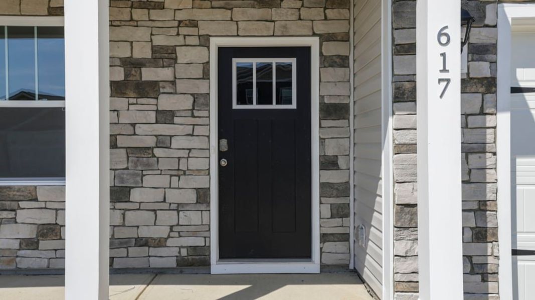 Exterior details and patio area of a home in Durbin Meadows Traditions, Fountain Inn (Image 3).