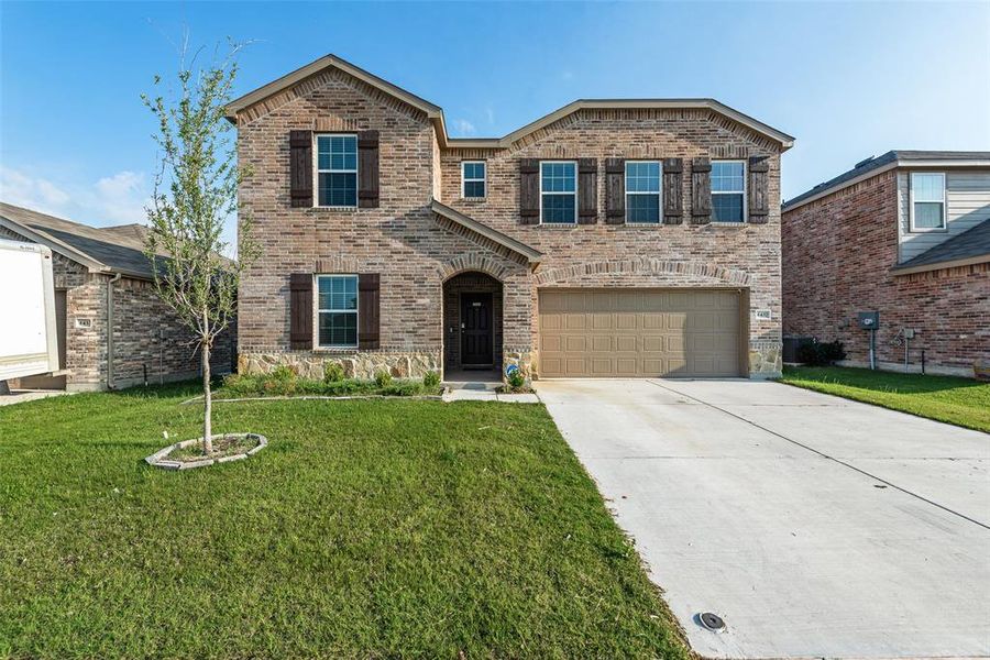 Front exterior of a new home in Newberry Point, Fort Worth, TX, highlighting curb appeal (Image 1). Front exterior of a new home in Newberry Point, Fort Worth, TX, highlighting curb appeal (Image 1).