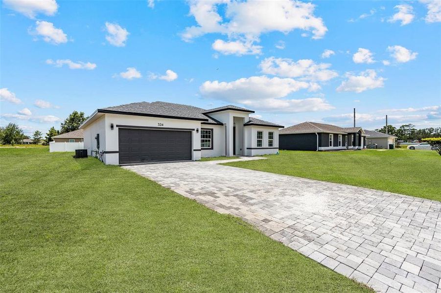Front exterior of a new home in , Ocala, FL, highlighting curb appeal (Image 2).