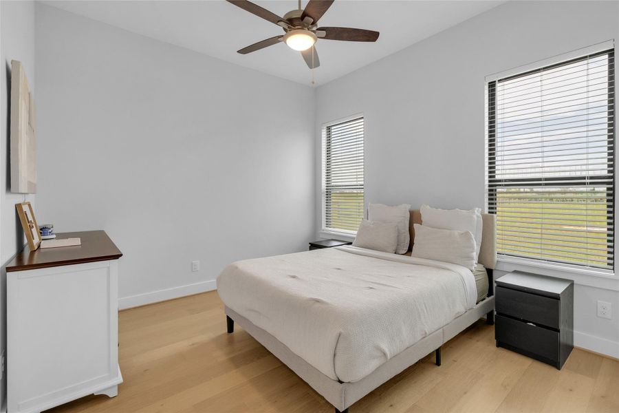 Spacious bedroom with abundant natural light.
