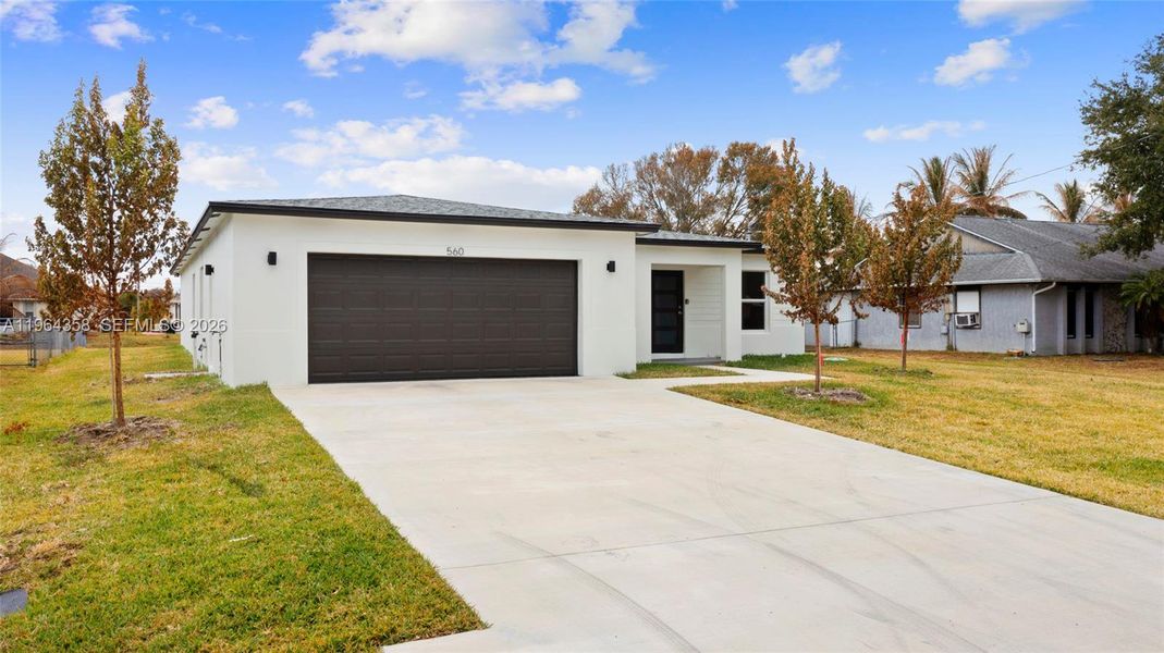 Front exterior of a new home in , Port St. Lucie, FL, highlighting curb appeal (Image 21). Front exterior of a new home in , Port St. Lucie, FL, highlighting curb appeal (Image 21).