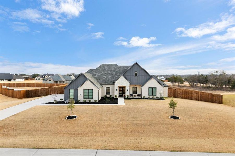 Front exterior of a new home in The Arbors Midlothian, Midlothian, TX, highlighting curb appeal (Image 22). Front exterior of a new home in The Arbors Midlothian, Midlothian, TX, highlighting curb appeal (Image 22).