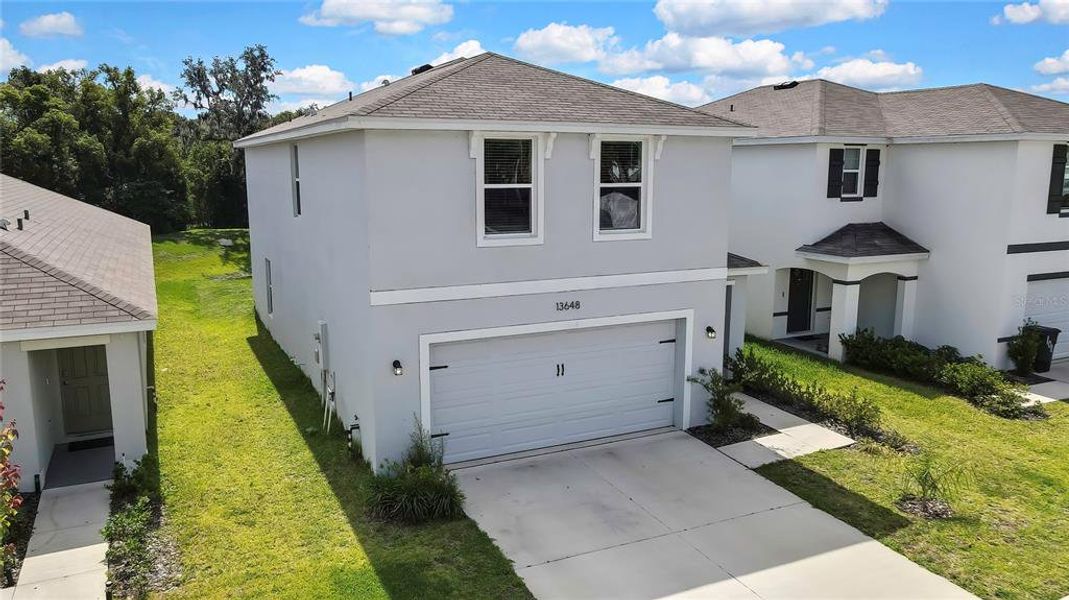 Front exterior of a new home in Heritage Hills, Dade City, FL, highlighting curb appeal (Image 24). Front exterior of a new home in Heritage Hills, Dade City, FL, highlighting curb appeal (Image 24).