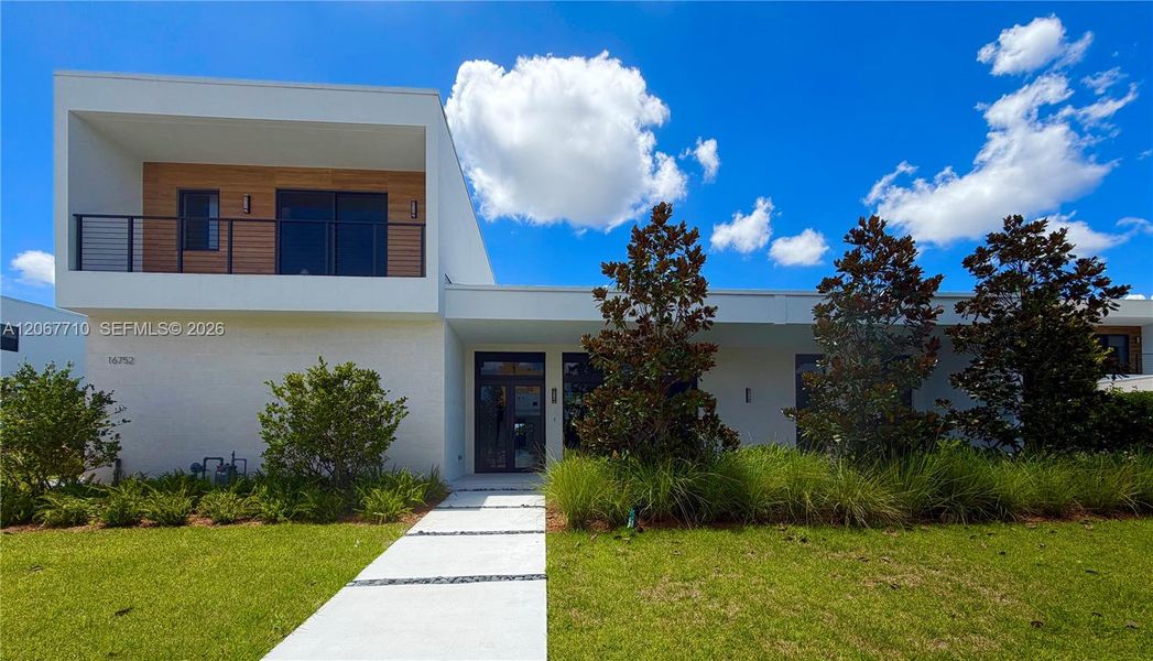 Front exterior of a new home in , Weston, FL, highlighting curb appeal (Image 1). Front exterior of a new home in , Weston, FL, highlighting curb appeal (Image 1).