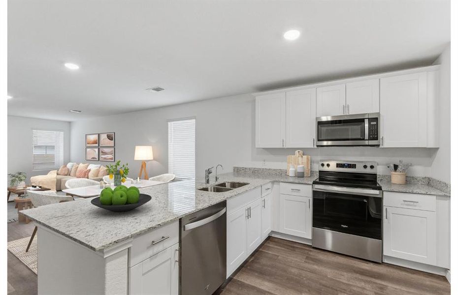 Virtual Staging - Bright Kitchen with abundant cabinet storage.