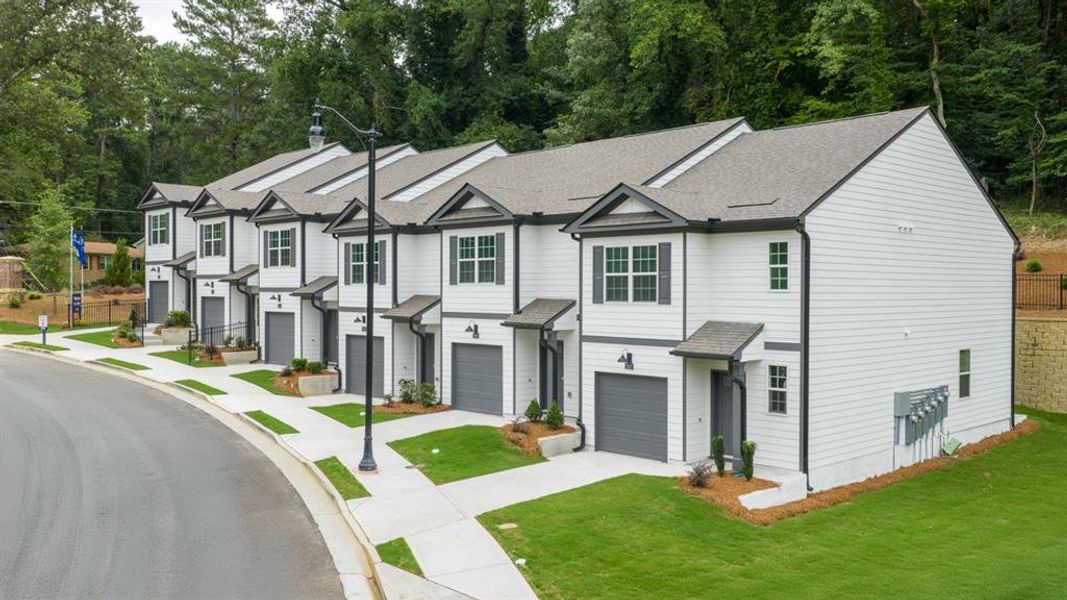 Front exterior of a new home in Towns at Monroe, Atlanta, GA, highlighting curb appeal (Image 19).