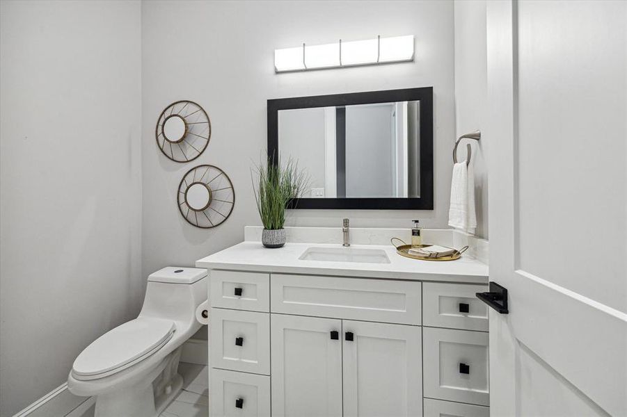 Powder bathroom with slab quartz vanity top