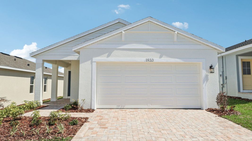 Representative exterior photo of a completed home built from the Flagler by DRB Homes in Liberty Trace, Haines City, FL (Image 12). Representative exterior photo of a completed home built from the Flagler by DRB Homes in Liberty Trace, Haines City, FL (Image 12).