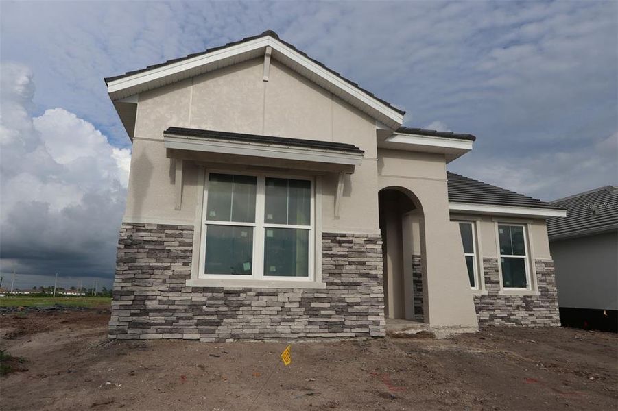 Exterior details and patio area of a home in Vistera of Venice – Cottage Series, Nokomis (Image 2).