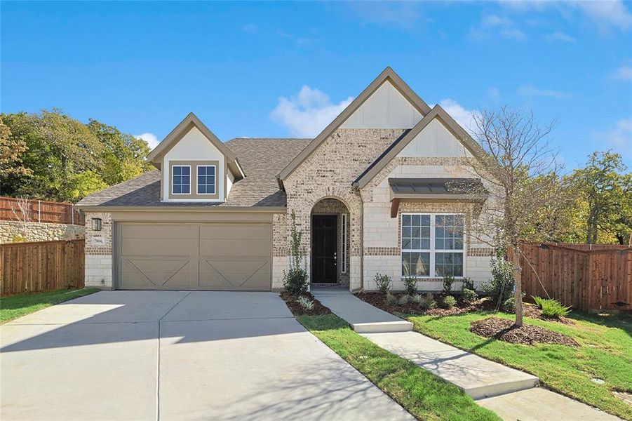 View of front of home featuring a garage