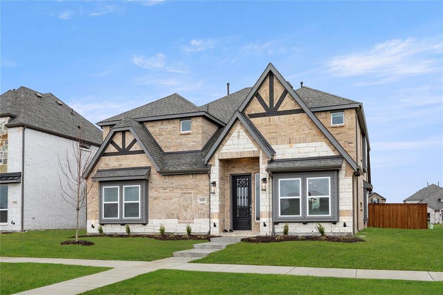 Front exterior of a new home in Villages of Creekwood, Frisco, TX, highlighting curb appeal (Image 1).