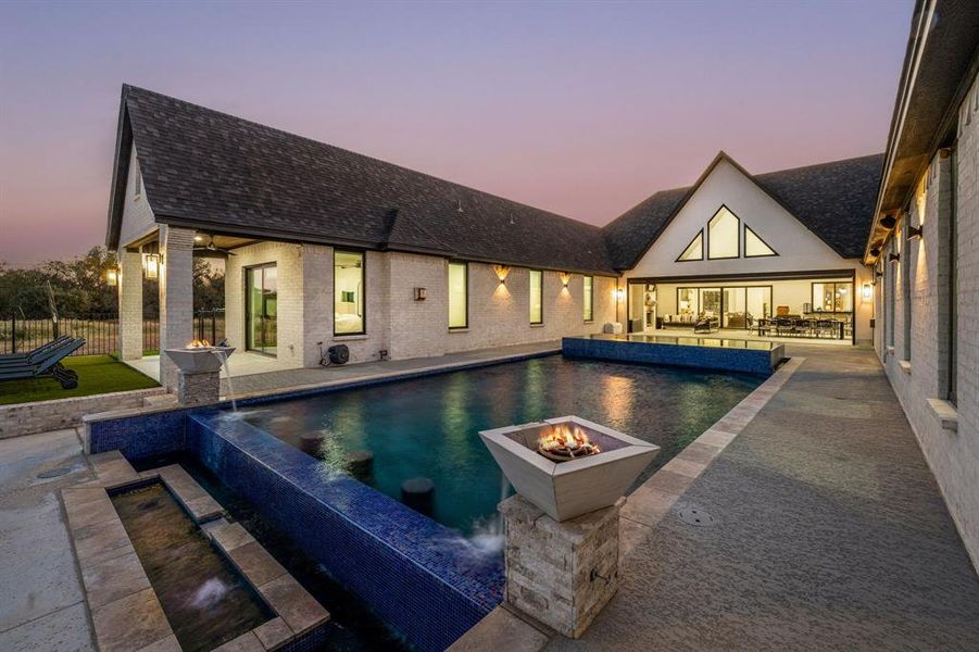 Exterior details and patio area of a home in , Pelican Bay (Image 3).