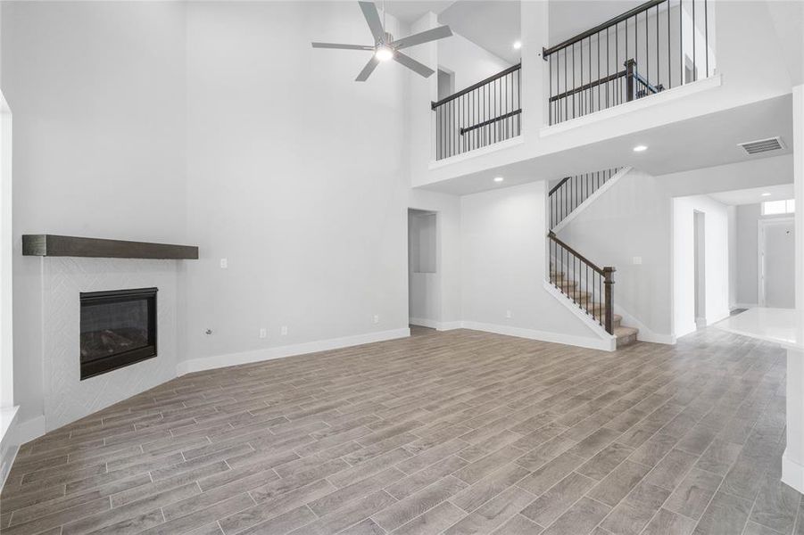 Another gorgeous view looking from the family room into the kitchen and upstairs game room.