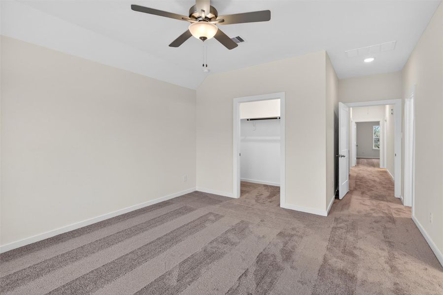 Expansive primary suite with a functional layout, complete with a large walk-in closet and easy access to the en-suite bath. Expansive primary suite with a functional layout, complete with a large walk-in closet and easy access to the en-suite bath.