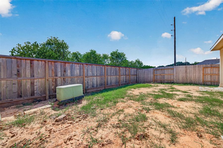Exterior details and patio area of a home in La Segarra, Brookshire (Image 24).
