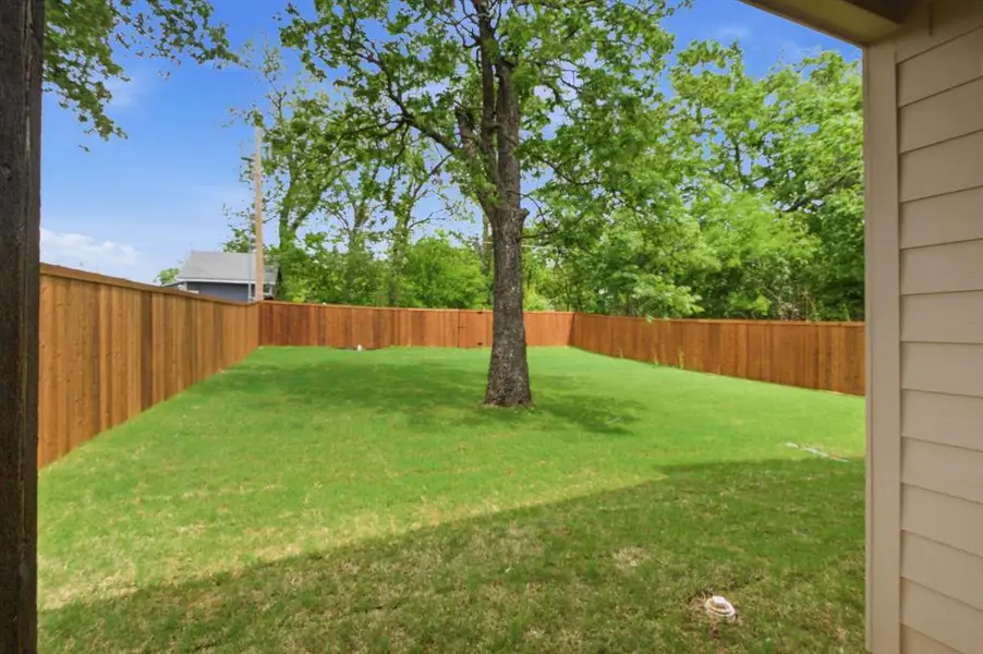 Exterior details and patio area of a home in , Denison (Image 24).