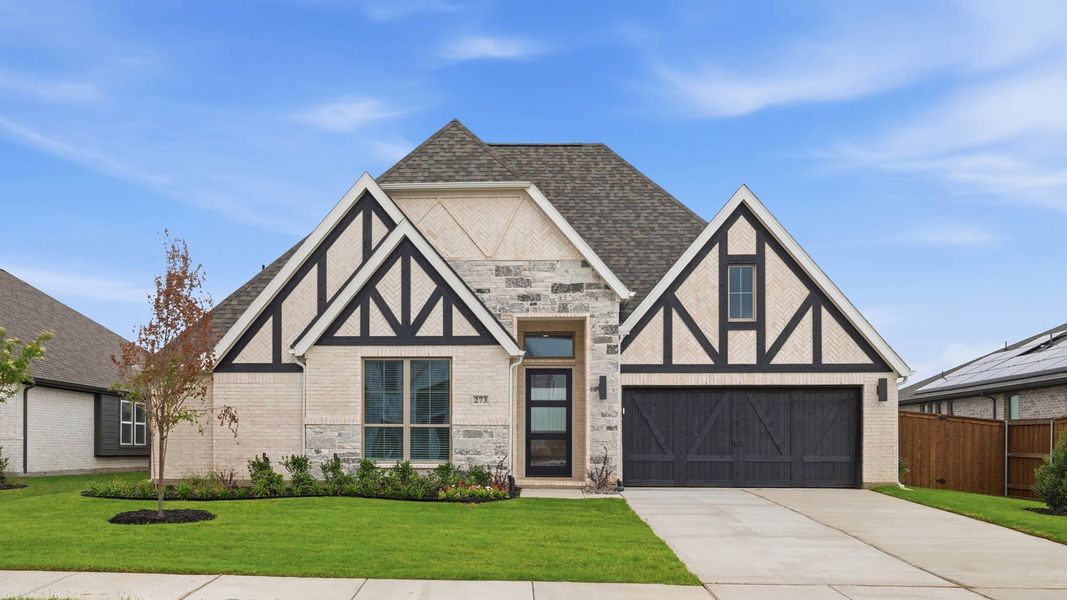 Front exterior of a new home in Myrtle Creek, Waxahachie, TX, highlighting curb appeal (Image 1). Front exterior of a new home in Myrtle Creek, Waxahachie, TX, highlighting curb appeal (Image 1).