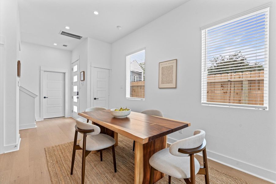 Elegant and inviting dining area designed for both everyday meals and special gatherings. The space features a well-proportioned layout that comfortably accommodates a full-size dining table, surrounded by stylish seating. Natural light filters in through nearby windows or glass doors, highlighting the room’s neutral palette and contemporary finishes. Elegant and inviting dining area designed for both everyday meals and special gatherings. The space features a well-proportioned layout that comfortably accommodates a full-size dining table, surrounded by stylish seating. Natural light filters in through nearby windows or glass doors, highlighting the room’s neutral palette and contemporary finishes.