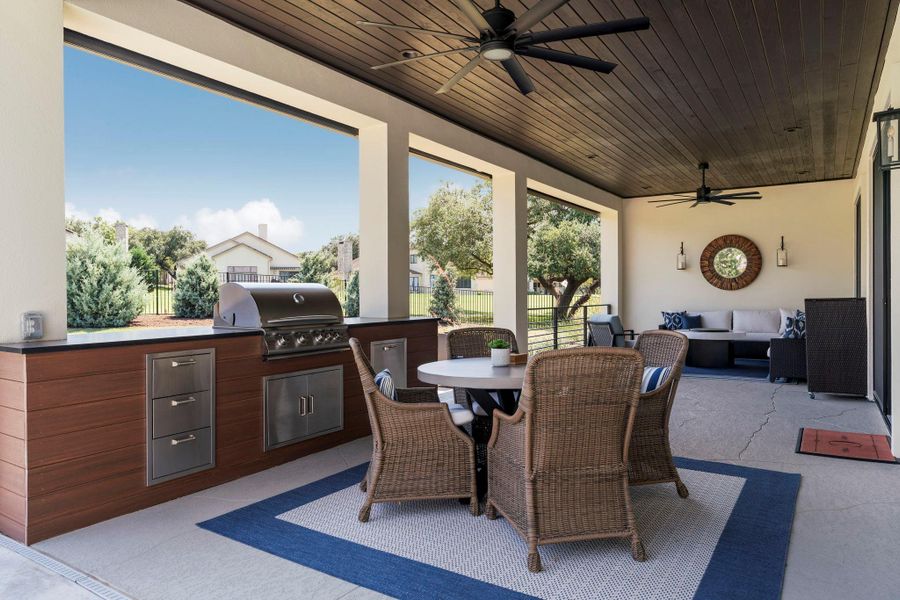 Backyard patio is spacious and ready for large gatherings or just relaxing outdoors with the the convenience of remote controlled features like, powered sun screens & fans. Pre-wired for additional uses plus 220v outlet for patio heater. Backyard patio is spacious and ready for large gatherings or just relaxing outdoors with the the convenience of remote controlled features like, powered sun screens & fans. Pre-wired for additional uses plus 220v outlet for patio heater.