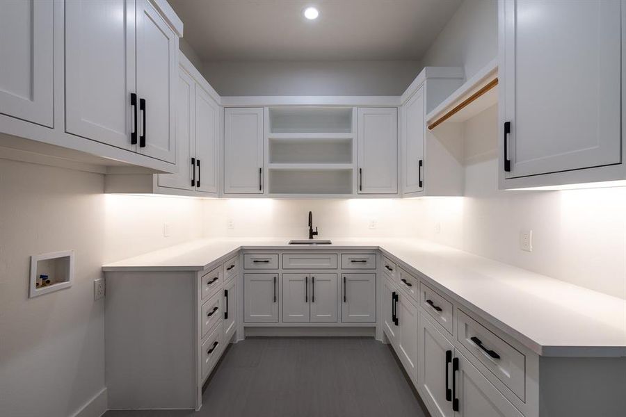 Kitchen with sink and white cabinets