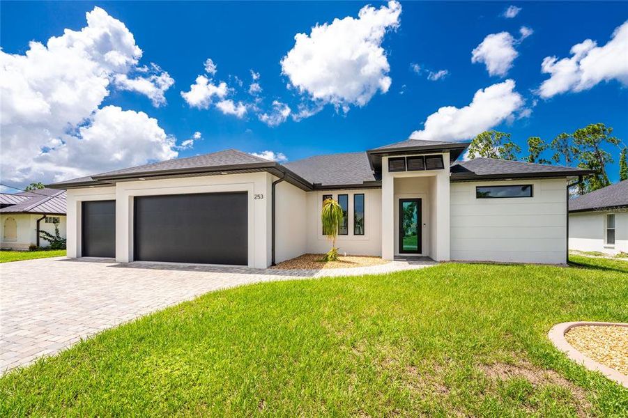 Front exterior of a new home in , Rotonda West, FL, highlighting curb appeal (Image 31).
