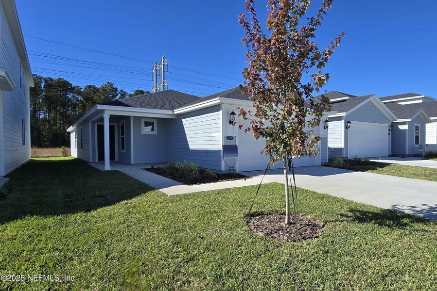 Front exterior of a new home in Kings Preserve, Jacksonville, FL, highlighting curb appeal (Image 2). Front exterior of a new home in Kings Preserve, Jacksonville, FL, highlighting curb appeal (Image 2).