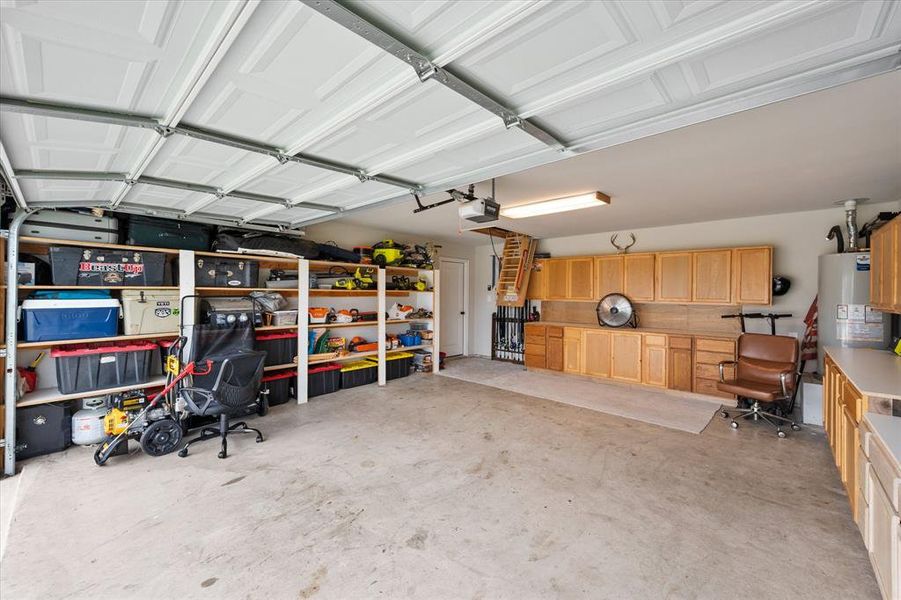 Lined with storage cabinets and shelving