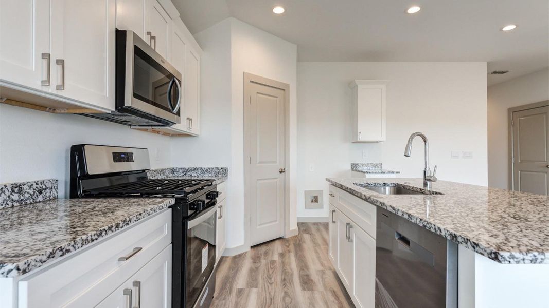 Representative furnished interior of a home built from the The Ashburn by D.R. Horton in Allen Farms, Lubbock (Image 9).