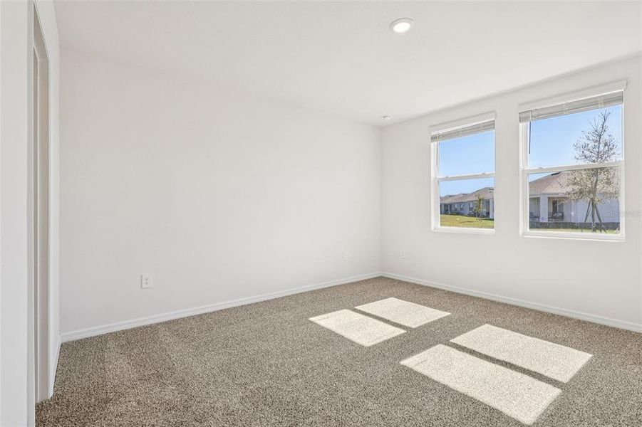 Spacious, unfurnished interior of a new home in Lake Deer Estates - Classic Series, Poinciana (Image 26).