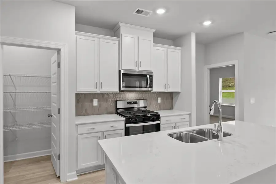 Furnished interior view inside a new home in The Farm at Wells Creek - Signature Collection, Gray Court (Image 5).