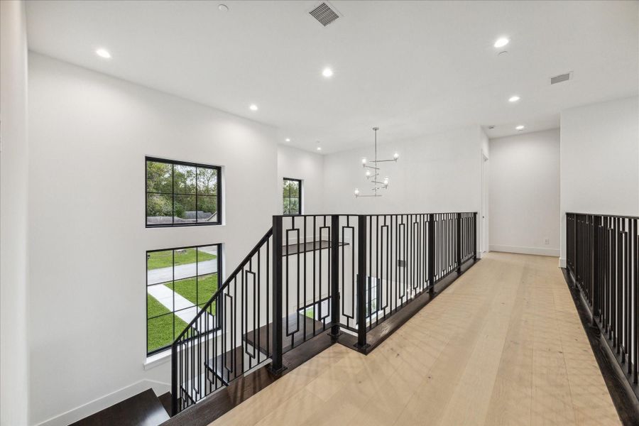 Breezeway is extra wide and overlooks foyer + family room Breezeway is extra wide and overlooks foyer + family room