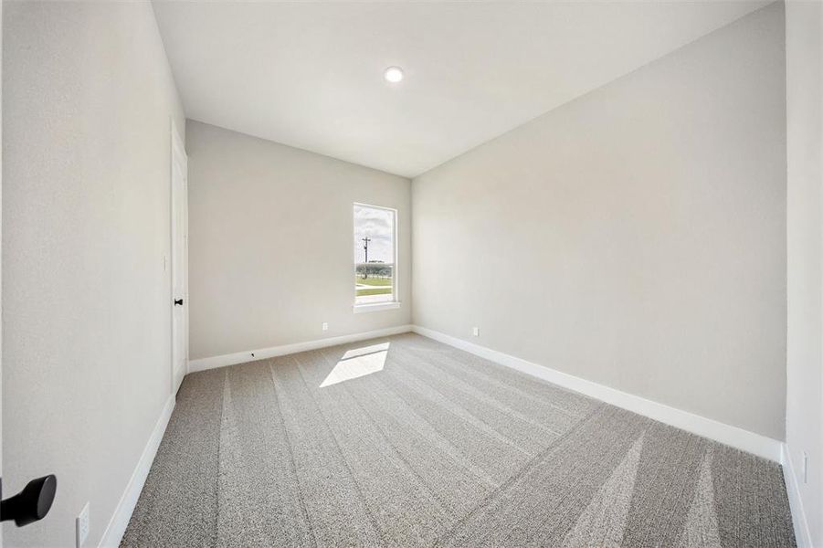 Empty room featuring carpet flooring and recessed lighting Empty room featuring carpet flooring and recessed lighting