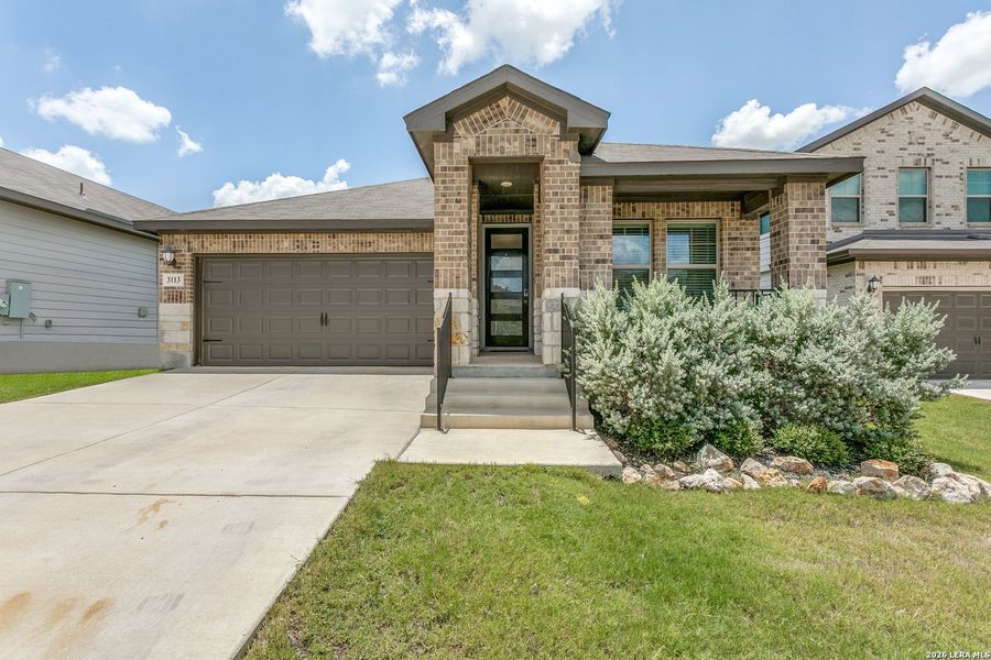Front exterior of a new home in Lark Canyon, New Braunfels, TX, highlighting curb appeal (Image 1). Front exterior of a new home in Lark Canyon, New Braunfels, TX, highlighting curb appeal (Image 1).