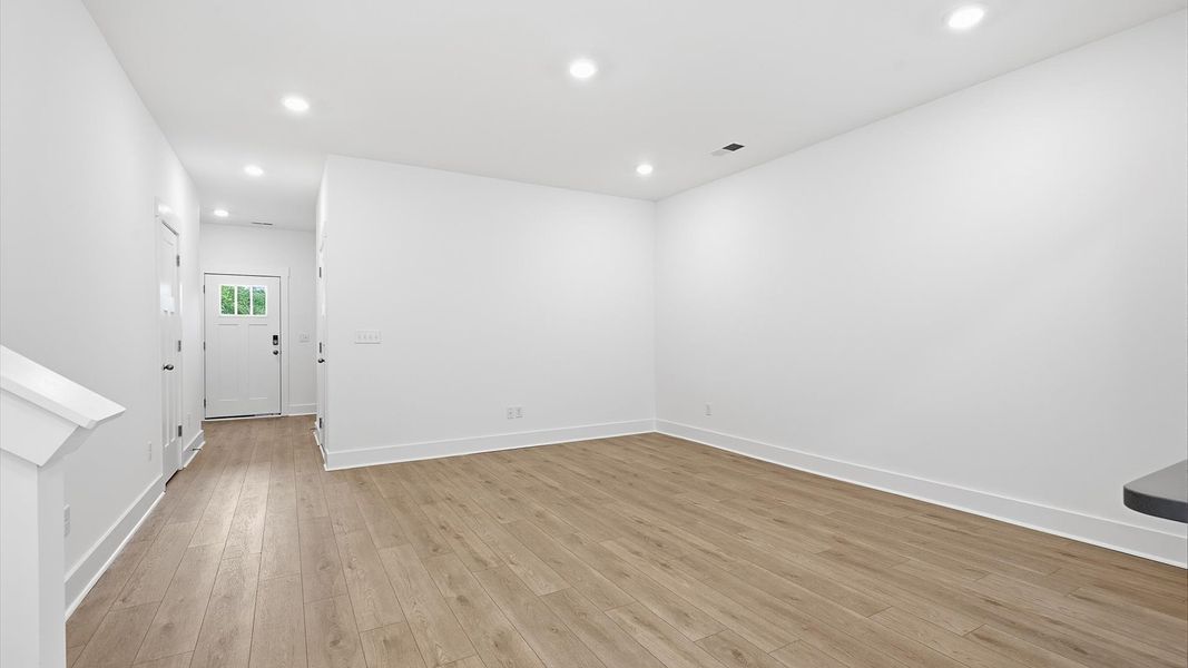 Elegant family room featuring hardwood flooring and thoughtful architectural detail at the new Marion Square community Elegant family room featuring hardwood flooring and thoughtful architectural detail at the new Marion Square community