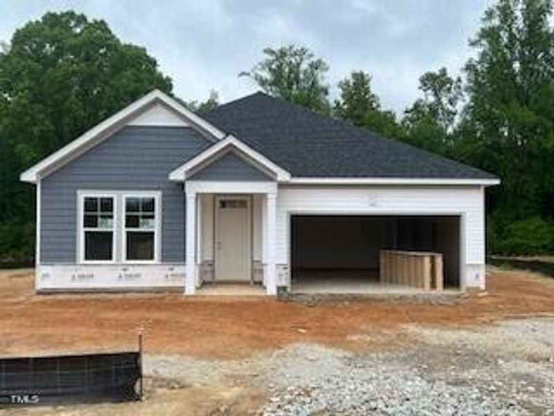Front exterior of a new home in Wellers Knoll, Lillington, NC, highlighting curb appeal (Image 26).