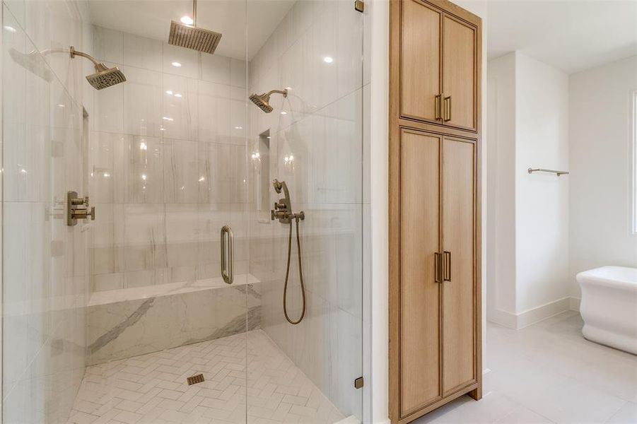 Full bath with a shower stall and light tile patterned floors Full bath with a shower stall and light tile patterned floors