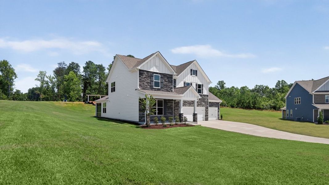 Representative exterior photo of a completed home built from the Hartwell by D.R. Horton in The Manors at Winston Pointe, Clayton, NC (Image 24).