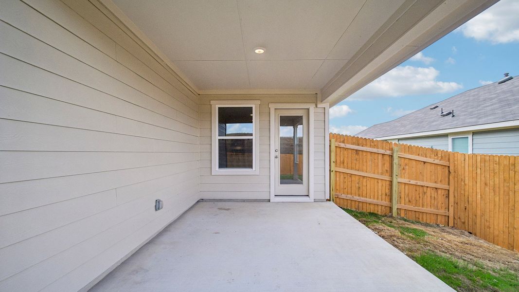 Exterior details and patio area of a home in Prairie Lakes, Buda (Image 19).