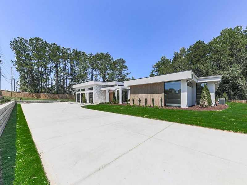 Front exterior of a new home in , Marietta, GA, highlighting curb appeal (Image 1). Front exterior of a new home in , Marietta, GA, highlighting curb appeal (Image 1).