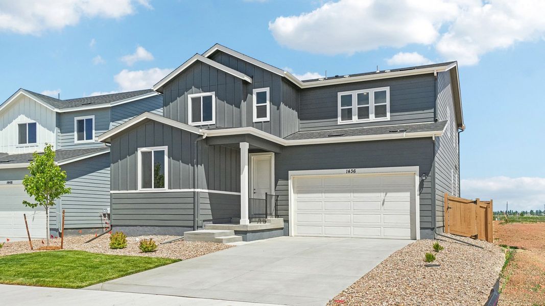 Front exterior of a new home in Trevenna, Windsor, CO, highlighting curb appeal (Image 22). Front exterior of a new home in Trevenna, Windsor, CO, highlighting curb appeal (Image 22).